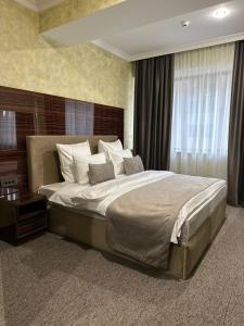 Ένα ή περισσότερα κρεβάτια σε δωμάτιο στο Nord Gate Avenue Hotel +66 φωτογραφίες