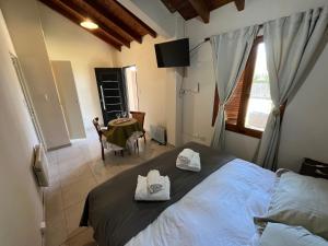 Postel nebo postele na pokoji v ubytování Chacras de Coria Centro Apart