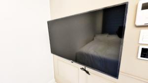 Телевизор и/или развлекательный центр в 미소 하우스, 대전시청역 도보2분 둔산동 번화가 신축