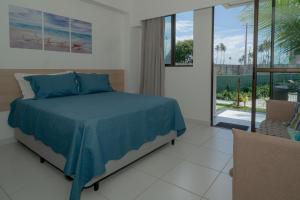 Giường trong phòng chung tại Refúgio Sol e mar Studio Resort em Muro Alto +47 ảnh