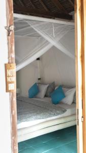 Postel nebo postele na pokoji v ubytování Buku Lodge Villa Spa Lombok + 34 fotografií