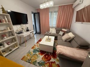 TV a/nebo společenská místnost v ubytování Vibe apartaments