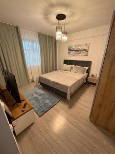 Postel nebo postele na pokoji v ubytování Vibe apartaments