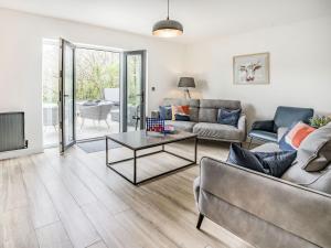 a living room with a couch and a table at Cefn Gelli in Clynderwen