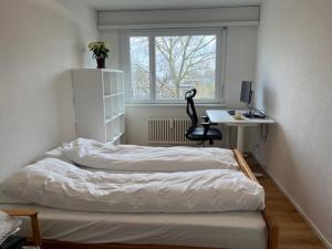 Postel nebo postele na pokoji v ubytování Green Basel Home