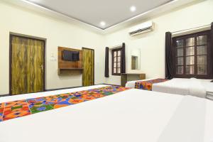 Ένα ή περισσότερα κρεβάτια σε δωμάτιο στο Hotel Rocking Yash Stays