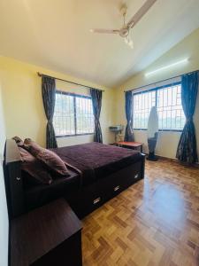 Ένα ή περισσότερα κρεβάτια σε δωμάτιο στο Green view villa