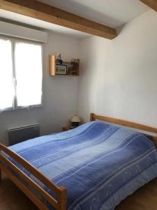 En eller flere senge i et værelse på Maison familiale spacieuse à Les Sables-d'Olonne