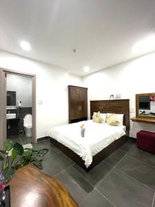 Postel nebo postele na pokoji v ubytování Căn hộ Đà Lạt Cảnh