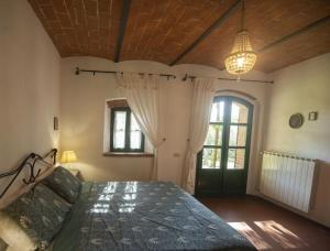 Postel nebo postele na pokoji v ubytování Podere Dolce Sonno