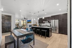 a kitchen and living room with a table and chairs at 50 East 6th Ave A3 in Silverthorne