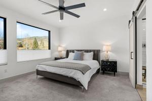 a bedroom with a bed and a ceiling fan at 50 East 6th Ave A3 in Silverthorne