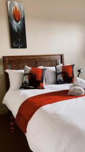 Ένα ή περισσότερα κρεβάτια σε δωμάτιο στο Andela Guesthouse