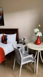 Ένα ή περισσότερα κρεβάτια σε δωμάτιο στο Andela Guesthouse