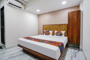 a bedroom with a large bed in a room at FabHotel New 7 Star in Mumbai +35 photos