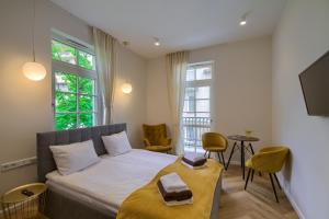 Ένα ή περισσότερα κρεβάτια σε δωμάτιο στο Mimoza