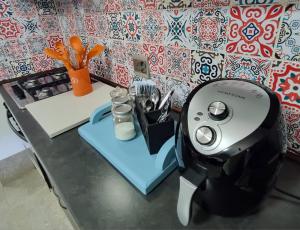 a hair dryer sitting on top of a table at Agulhas Stay in Agulhas