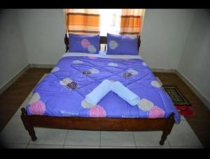 Ένα ή περισσότερα κρεβάτια σε δωμάτιο στο Pam Palatial Home