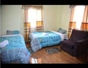 Ένα ή περισσότερα κρεβάτια σε δωμάτιο στο Pam Palatial Home