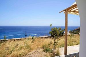 a view of the ocean from a house at The endless blue experience in Ios Chora +20 photos