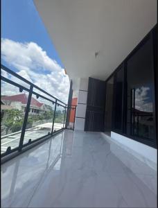 an empty balcony with a view of a building at Villa Velare 03 dharmahusada indah galaxy mall in Surabaya