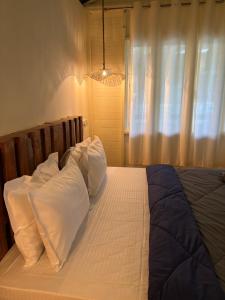 Postel nebo postele na pokoji v ubytování Bibhitaki Boutique Beach Stays