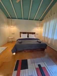 Postel nebo postele na pokoji v ubytování Bibhitaki Boutique Beach Stays