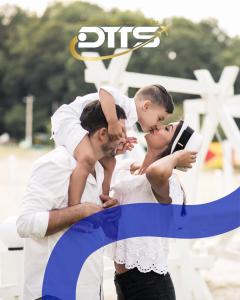 a man and a woman in white posing for a picture at dtts in Lahore