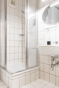 a bathroom with a shower and a sink at Bergblick Appartements in Bad Gastein