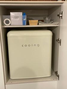 a white container in a shelf in a drawer at stay early mansion 가산, 홍대, 고척돔 in Seoul +14 photos