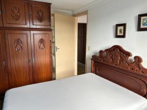 Postel nebo postele na pokoji v ubytování Apartamento Retrô