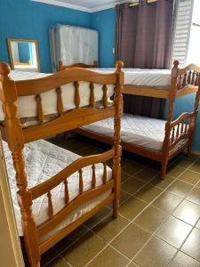 Postel nebo postele na pokoji v ubytování Apartamento Retrô