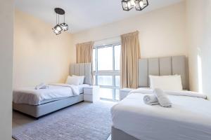 En eller flere senge i et værelse på Malibu Luxe I Priavte Pool I 5 bed Villa + 36 billeder