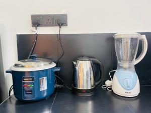 a blender and a toaster sitting on a counter at Sanu Surfing Villa in Weligama