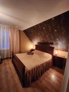 Ένα ή περισσότερα κρεβάτια σε δωμάτιο στο Brīvdienu māja Lielzemenes