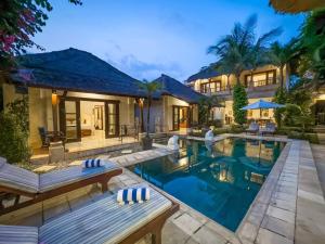 an image of a villa with a swimming pool at Arjuna Villa 3 Bedroom Villa Seminyak in Seminyak