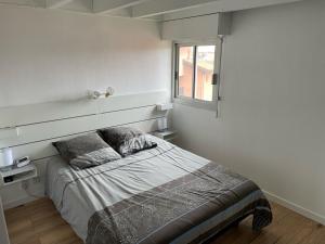 Ένα ή περισσότερα κρεβάτια σε δωμάτιο στο Superbe Appartement Vue Océan