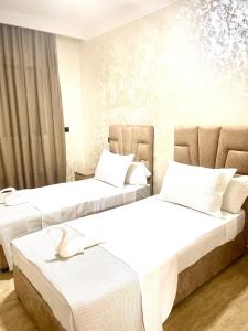 Una cama o camas en una habitación de Modern Central Apartment in Casablanca