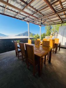 a dining room with a wooden table and chairs at pinggan box glamping in Bangli +27 photos