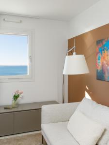 Ένα ή περισσότερα κρεβάτια σε δωμάτιο στο Portopiccolo Apartments - Perla nel borgo