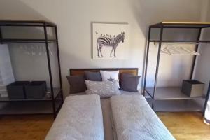 Postel nebo postele na pokoji v ubytování NEU! Ferienwohnung Design 2 Wasserburger Land