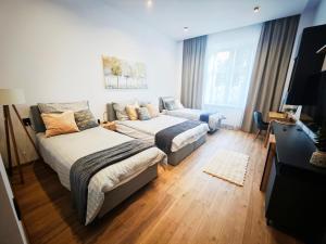 Postel nebo postele na pokoji v ubytování Old Town Apartment