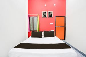 Postel nebo postele na pokoji v ubytování Hotel O ORM Inn