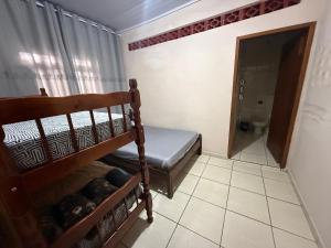 Una cama o camas en una habitación de Casa Aparecida do Norte