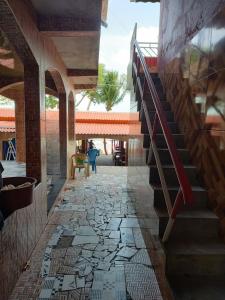 a staircase in a house with mosaic floors at Point da ilha in Belém