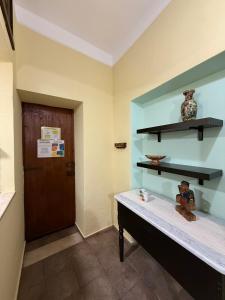 a room with a shelf and a table with a teddy bear at Antica Dimora in Quartu SantʼElena +46 photos