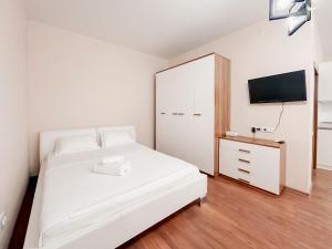 Postel nebo postele na pokoji v ubytování Жилой комплекс Ирина + 9 fotografií