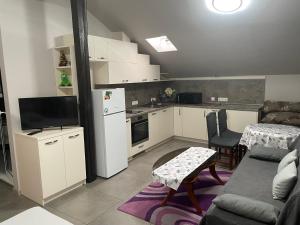 Kuchyň nebo kuchyňský kout v ubytování Hotel Darling