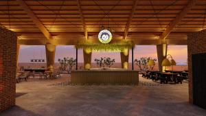 a pavilion with a clock on the top of it at Mad Monkey Kampot in Phumĭ Prêk Chrey