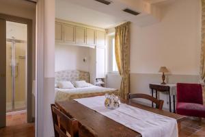 Ένα ή περισσότερα κρεβάτια σε δωμάτιο στο Mater Matuta